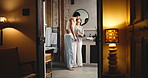 Happy couple, embrace and kiss in bathroom, night affection and love for relationship bonding together. Connection, care or people smile for support in apartment, evening hug and romance in apartment
