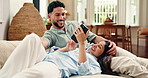 Mobile, relax and happy couple talking in living room for social media, laugh and communication. Phone, man and woman on sofa in home for conversation together, love and funny joke on internet
