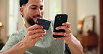 Credit card, happy or man in home with phone, online payment or sales promo in eft transaction. Flare, easy shopping or male person in house with tech, remote service or discount on cashless purchase