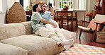 Kiss, happy couple and selfie in home for love, social media update or funny memory on sofa. Smile, man and woman with photo in living room for romantic relationship, laugh and relax with partner