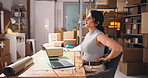 Frustrated, woman and back pain in office with laptop for ecommerce backlog, logistics fail or crisis. Computer, exhausted person and spinal injury with bad posture, supplier issue and courier delay.