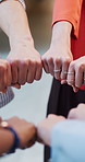Office, fist bump and hands of business people in circle for collaboration, partnership and teamwork. Startup, diversity and workers with gesture for agreement, solidarity and support in workplace