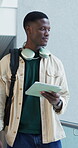 Student, man and walking with tablet at university for semester start, explore campus or learning. Education, study and black person with tech for college tour, scholarship opportunity and knowledge