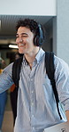 Happy, student and headphones with high five at university for greeting, positive energy and music. College, people and smile with fist bump in hallway for campus culture, feel good playlist or study
