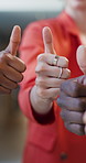 Thumbs up, teamwork and hands of business people in office for agreement, support and feedback. Startup, collaboration and workers with emoji for partnership, yes sign and approval for opinion