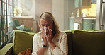 Woman, sneeze or blowing nose on sofa with tissue for influenza, health problem and virus symptoms. Sick person, allergies or illness in house with toilet paper for hayfever, cold or sinus infection.