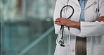 Hands, arms crossed and doctor with stethoscope in hospital for heart health, professional or pride. Woman, medical worker and tools for cardiology, wellness and confident cardiologist in clinic