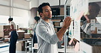 Businessman, writing or planning with tablet for logistics, supply chain or services on glass board. Man, distributor or supplier with technology or ideas for small business startup or distribution