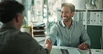 Man, interview and shaking hands with resume at office with smile, review and onboarding process at company. People, HR manager and success with job application, handshake or recruitment at agency