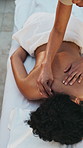 Spa, hands and massage with hot stone, healing and treatment for holistic benefits and stress relief. Hospitality, masseuse and person on holiday for peace, above and comfortable at wellness resort