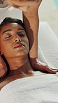Women, shoulder massage and relax at spa, smile and holistic treatment for muscle, circulation or wellness. People, masseuse and client with physical therapy, above or pain relief at holiday resort