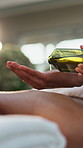 Spa, hands and massage with oil, luxury and skin treatment with holistic benefits and stress relief. Hospitality, masseuse and client on vacation for peace, people and comfortable at wellness resort