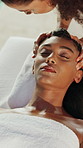 Woman, massage head and relax at spa, bed and holistic treatment with temple, circulation or wellness. People, masseuse and client with physical therapy, above or pain relief at holiday resort