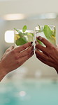 Drinking, hands and women with cocktail for cheers at hotel for summer vacation, getaway or weekend trip. Toast, outdoor and friends with alcohol beverage for break with hospitality at accommodation.