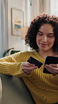 Woman, credit card and payment on sofa with phone, online shopping purchase and Black Friday sale. Person, smile and typing in home with tech for ecommerce checkout, discount and fintech transaction.
