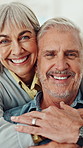 Smile, hug and face of senior couple in home for marriage, bonding or connection together. Portrait, retirement and elderly woman embracing man for relationship, support or care in living room.