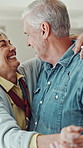 Happy, dancing and elderly couple in home for bonding, connection and commitment together. Retirement, hug and senior man and woman for love, relationship and marriage with movement, music and spin