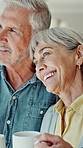 Happy, coffee and senior couple in kitchen in home for hugging, bonding or connection together. Smile, love and elderly man with woman for drinking warm beverage in morning with support in house