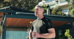 Water, thinking and fitness with man outdoor for vision, hydration or training recovery. Electrolyte drink, reflection or wellness with mature person at house for athlete, exercise and mineral liquid