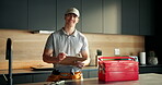 Tool box, plumber and face with man in kitchen for home improvement, pipe maintenance and leak detection. Water damage, handyman and inspection with person  in house for labor and installation 