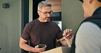 Delivery man, client and signature with phone at front door for box, invoice or happy with ecommerce. Mature person, courier and smartphone with mobile app, package and thank you with order at house