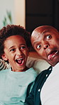 Funny face, selfie and dad with child in home for bonding, happy memory or social media update. African family, father and picture with boy for silly post, goofy photo and tongue out in living room