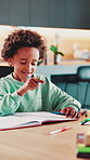 Education, notebook and kids with homework in house for learning, studying or development. Writing, knowledge and boy children students with skills for assignment, test or assessment in apartment.
