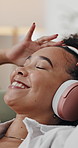 Happy woman, headphones and listening with music in home for audio streaming or entertainment. Female person, relax and podcast with smile, tune or comfort for sound app, playlist or songs in house