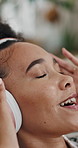 Happy woman, headphones and listening with music for audio streaming or entertainment in home. Female person, relax and podcast with smile, tune or comfort for sound app, playlist or songs in house