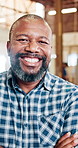 Black man, face or carpenter with confidence for woodwork, timber service or furniture business. Portrait, male person or artisan with smile or arms crossed for lumber, craft or carpentry in workshop