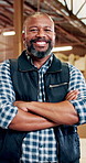 Black man, face or carpenter with confidence for furniture business, woodwork or timber service. Portrait, male person or artisan with smile or arms crossed for lumber, craft or carpentry in workshop