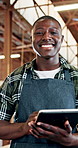 Happy, black man and face of carpenter with tablet for wood production or furniture business. Portrait, male person or timber artisan with smile or technology for storage or inventory in workshop