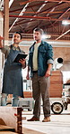 Men, carpenter and tablet at factory, planning and team talk at furniture manufacturing job. People, technician and point with discussion for material, app or design review for production at workshop
