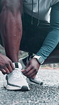 Man, hands or runner tying with shoe on road for workout preparation, exercise or outdoor training. Closeup, male person or getting ready with sneaker, tie or laces for physical fitness on asphalt