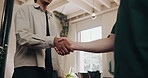 Below, men and handshake with barber at hair salon for welcome, introduction and service deal. People, shaking hands and respect for customer appreciation, haircut agreement and grooming appointment