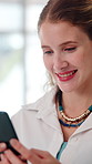Happy, phone and business woman in office for social networking, online chat and email communication. Professional, workplace and person typing on smartphone for notification, message and connection