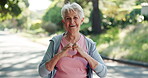 Face, old woman and heart sign outdoor for fitness, exercise and care for wellness routine. Portrait, elderly person and love gesture for training, romantic emoji and support for sports goals in park