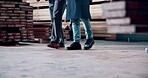Walking, carpenter and people in warehouse, legs and woodworking for furniture production or project. Artisan, entrepreneur and teamwork in factory for carpentry, quality assurance and manufacturing