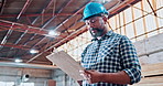 Carpenter, man and writing in warehouse with clipboard, manufacturing inspection and quality control. Low angle, black person and checklist in factory for woodwork production, maintenance and repair.
