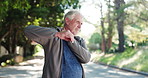 Elderly man, neck pain and neighborhood with injury on road for workout accident or emergency. Senior, male person or sore joint with shoulder for muscle tension, bruise or sprain on street in town