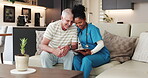 Clipboard, nurse and senior man hug on couch for positive health results, reading report and support. Retirement, good news and happy people talking in nursing home, medical record and elderly care