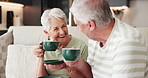 Home, coffee and old couple on couch, funny and bonding together with smile, love and joke. Laughing, man and woman on sofa, caffeine or retirement with break, herbal tea or humor with relationship