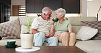 Old couple, talk and laughing on sofa with tea for connection, funny story and bonding together. Senior people, conversation and smile in home with hot drink for love, wellness and enjoy retirement.