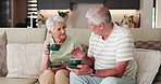 Home, coffee and old couple on couch, talking and bonding together with love, romance and trust. Relationship, man and woman on sofa, caffeine or retirement with herbal tea, marriage and conversation