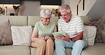 Old couple, smile and tablet on sofa for movies, streaming or subscription in living room. Elderly man, woman or senior people on couch in house together for retirement, bonding and love with tech