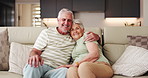 Old couple, face and bonding in lounge, people and hug with smile on couch, retirement and affection. Happy, elderly man and home with senior woman in living room, embrace and romance with partner
