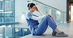 Woman, nurse and headache in stress, burnout or mistake on floor in hospital. Mental health, sad physician and healthcare person with emergency for anxiety, loss or failed surgery grief at clinic