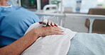 Medical, hands or patient in hospital with oximeter, surgery recovery or monitor in treatment. Healthcare, mature or person in clinic with pulse meter, heart rate or oxygen track in post operation.