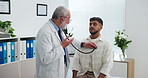 Mature man, doctor and stethoscope with patient for heart rate, breathing exercise or checkup. Male person, cardiologist and checking client with chest for medical examination or test in clinic