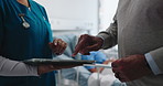 Hands, tablet and senior person in hospital with nurse, patient and healthcare or cancer treatment. Recovery, support and couple in clinic with tech, advice or planning for surgery in retirement